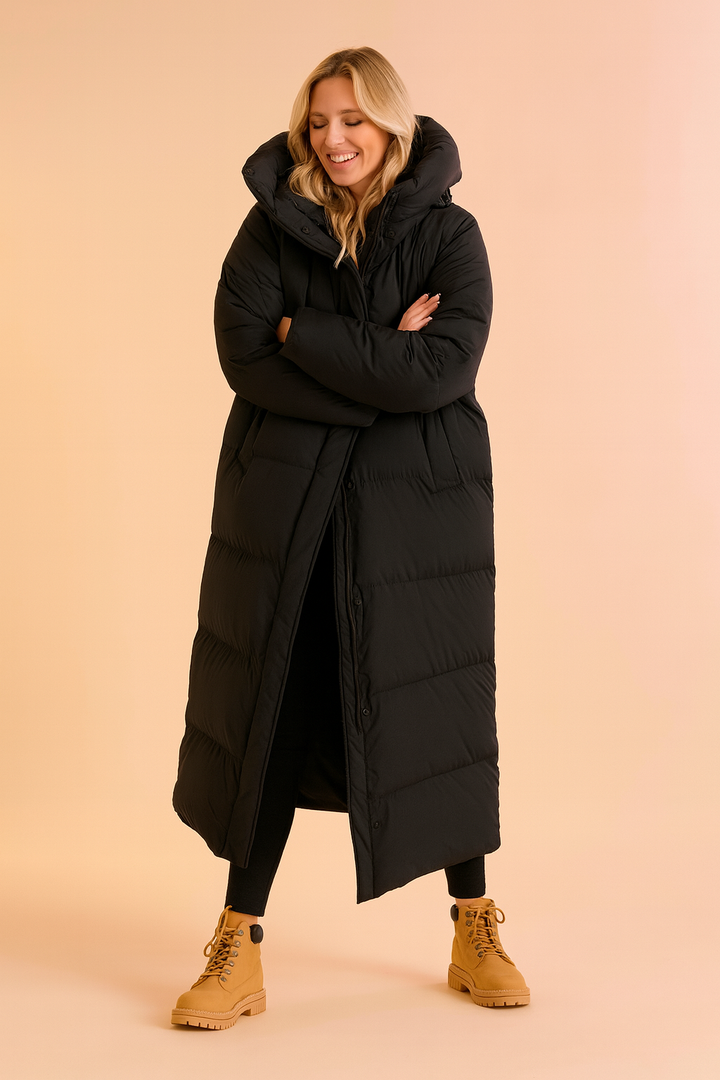 Chic women's long hooded puffer jacket, ideal for cold weather and trendy winter style.