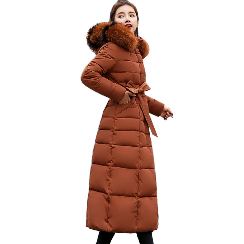 Essential women's long quilted winter parka with hood & belt, designed for warmth & ladies fashion.