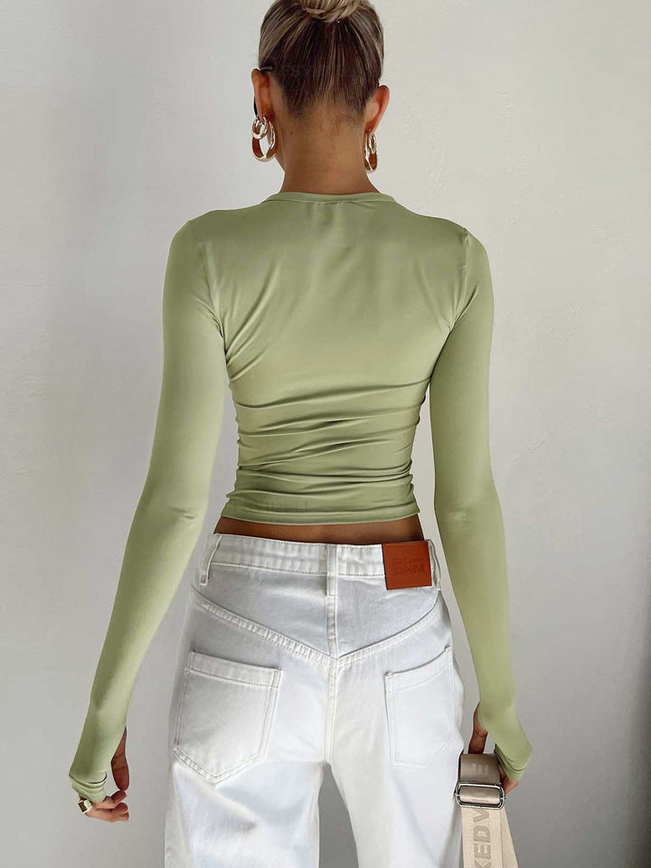 Stylish women's black long sleeve crop top, ideal for summer outfits and everyday comfort