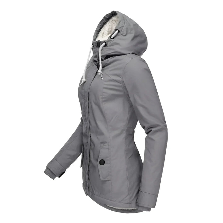 Winter fashion: women's long coat, waterproof material and soft fleece lining.