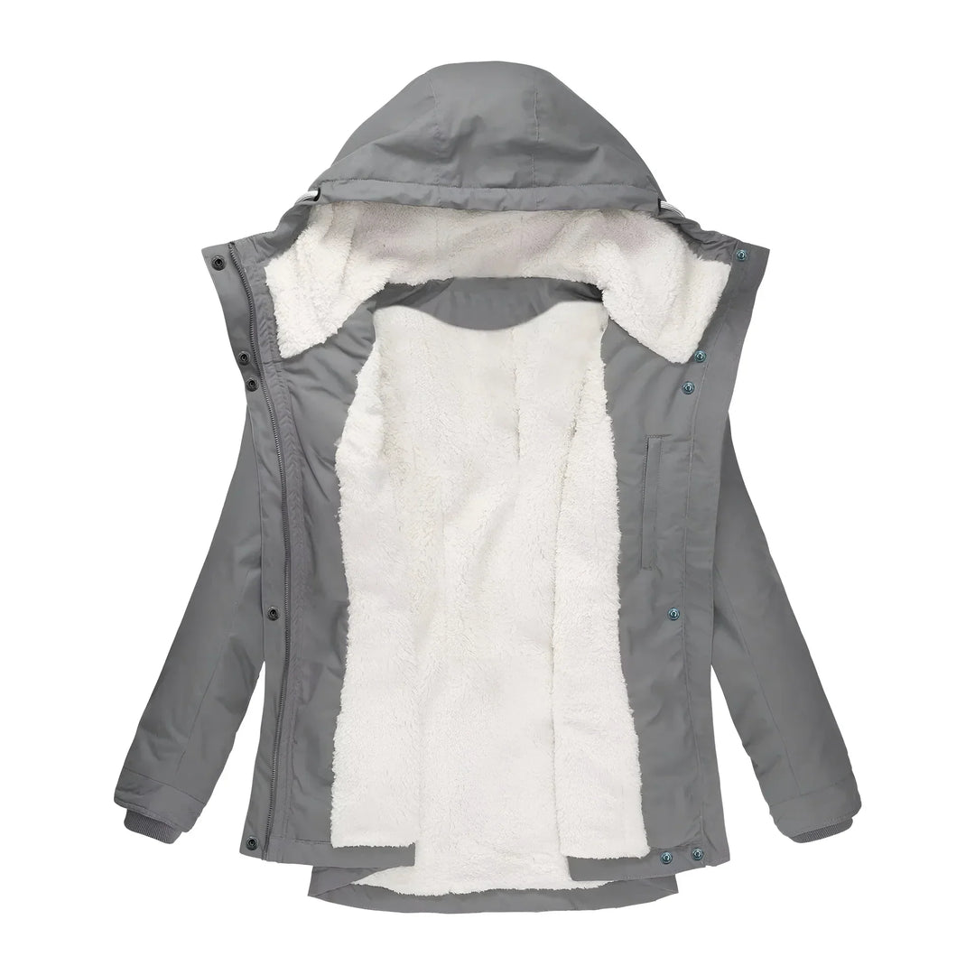 Elegant women's long waterproof coat, designed for warmth in harsh winter conditions.