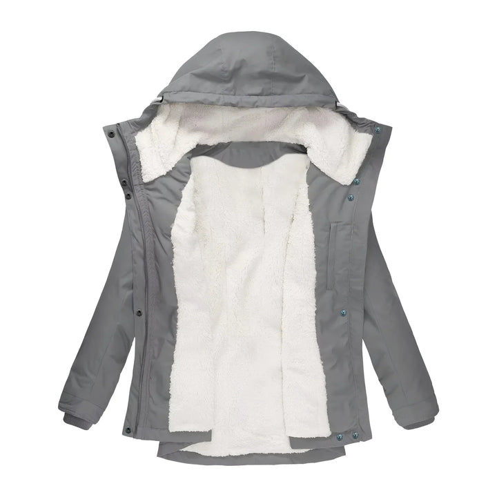 Elegant women's long waterproof coat, designed for warmth in harsh winter conditions.