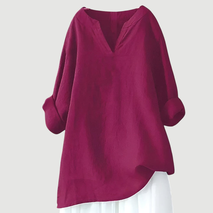 Model wearing a pink loose fit women's shirt, ideal for breathable comfort