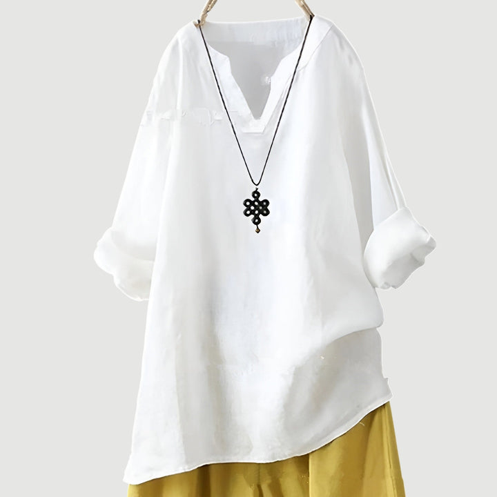 Folded various colored women's breathable shirts, highlighting comfort and casual style