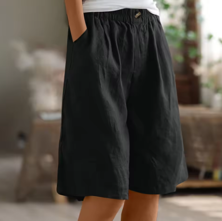 Women's casual beach shorts with an elastic waist, designed for a loose, comfortable fit.