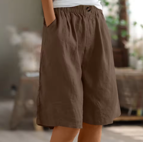 Back view of women's comfortable loose fit summer shorts, featuring an elastic waistband.