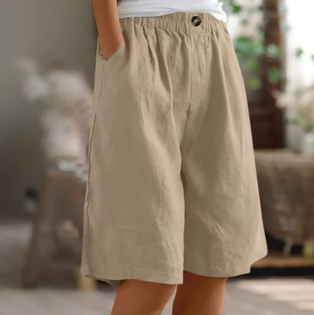 Women wearing high-waisted loose fit shorts, showcasing the relaxed casual style for summer.