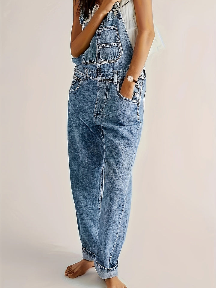 Woman casually walking in comfortable loose fit denim dungarees, perfect for everyday outfits.