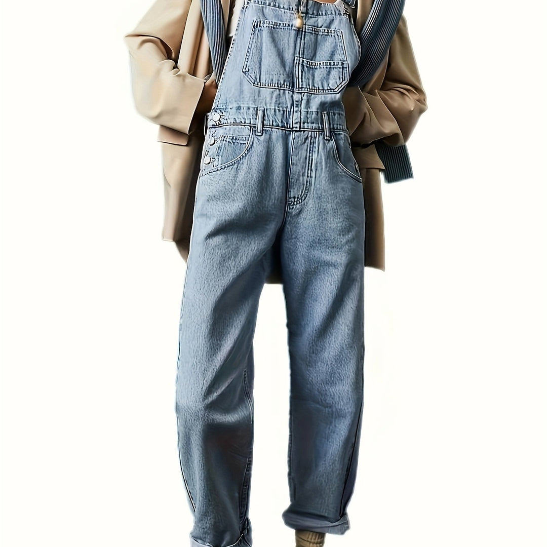 Durable buttons & hardware on women's loose fit denim dungarees, enhancing casual comfort.