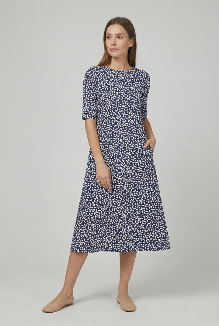 Trendy women's floral midi dress, short sleeve, loose fit, versatile for casual summer fashion or garden parties.