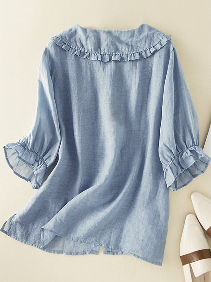 White loose fit blouse featuring a delicate ruffle collar, a versatile women's summer top.