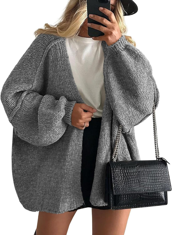 Model wearing a blue loose fit open front knit cardigan for women, styled for a relaxed spring look
