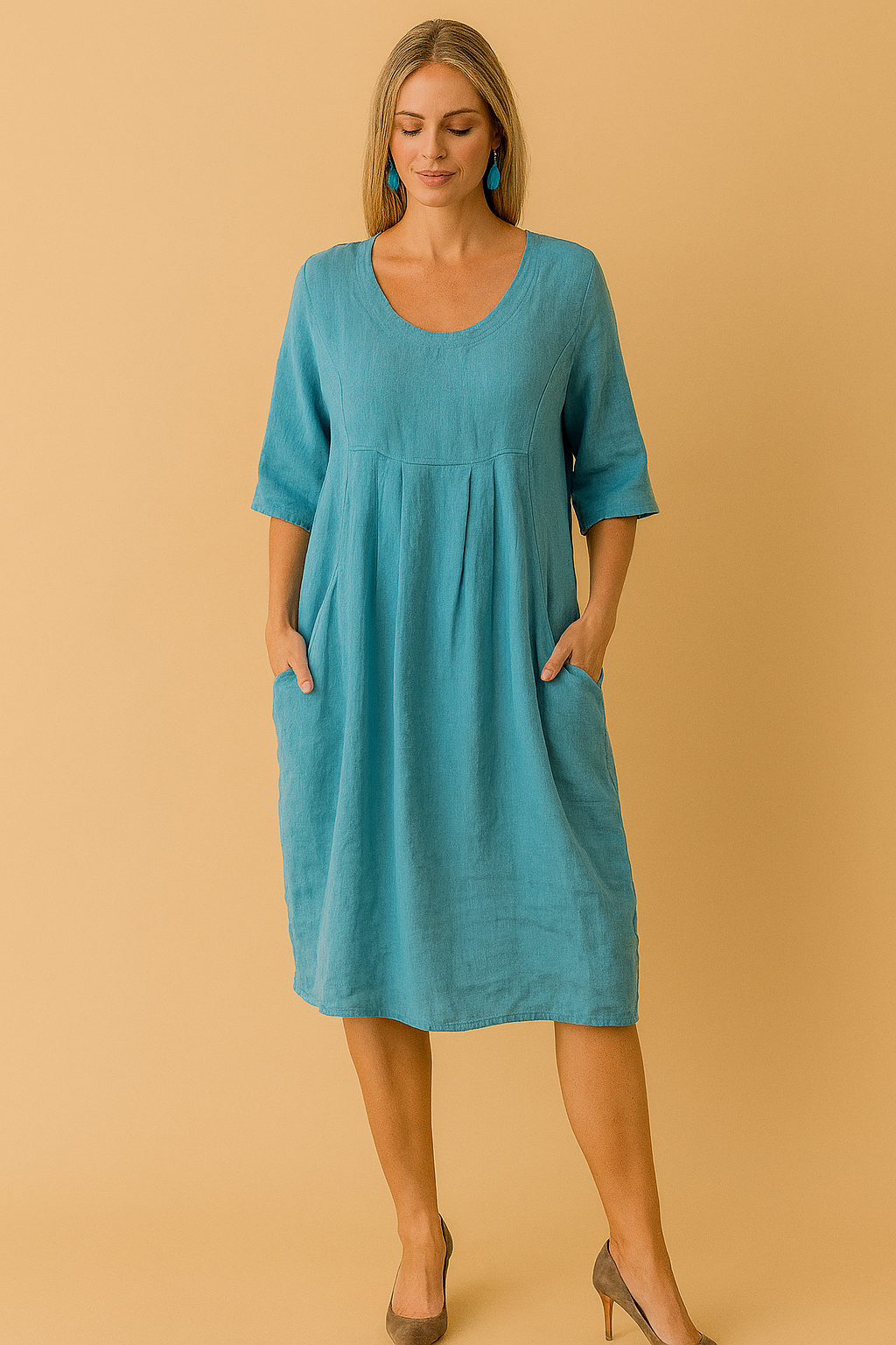 Women's loose summer dress with round neck, short sleeves & pockets. Comfortable knee-length casual swing dress.