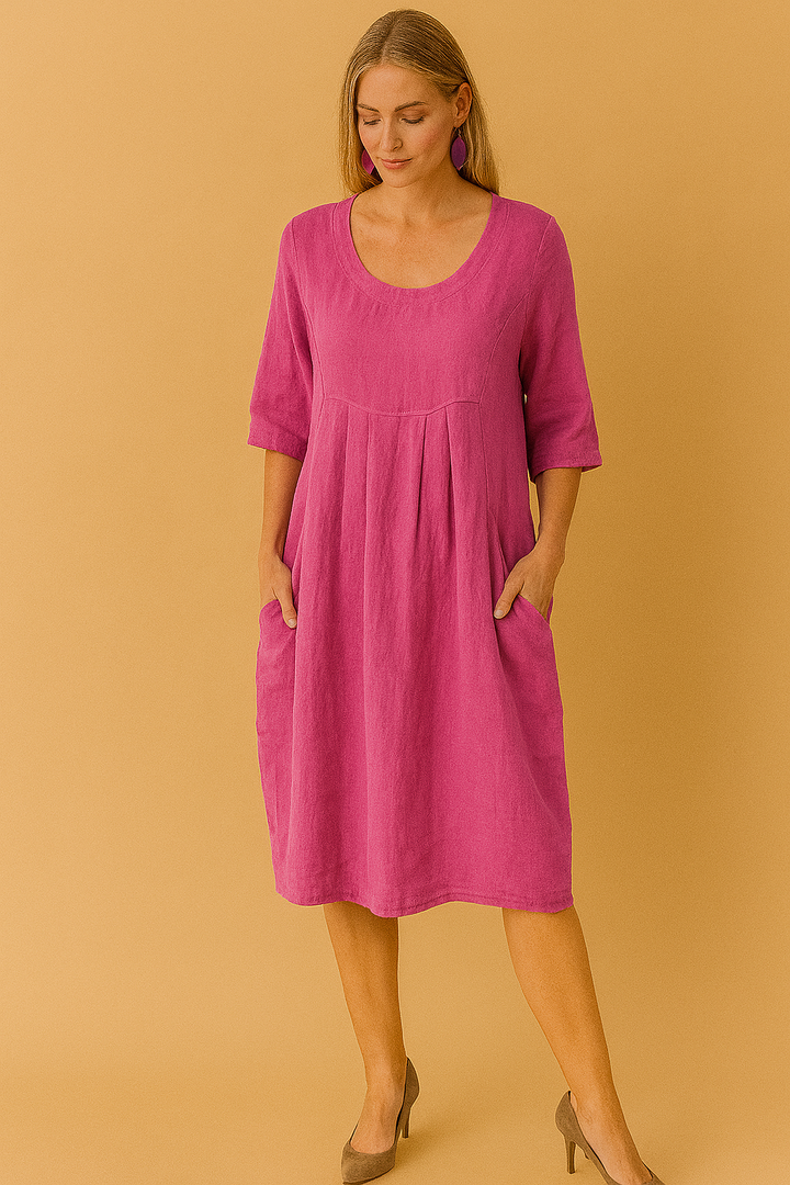 Comfortable women's knee-length summer dress, perfect for casual everyday wear. Features round neck & pockets.