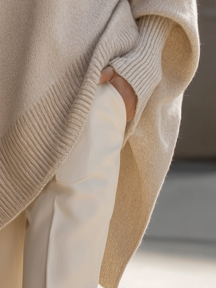 Close-up of the wool blend knit texture on a women's oversized long sleeve sweater, comfortable