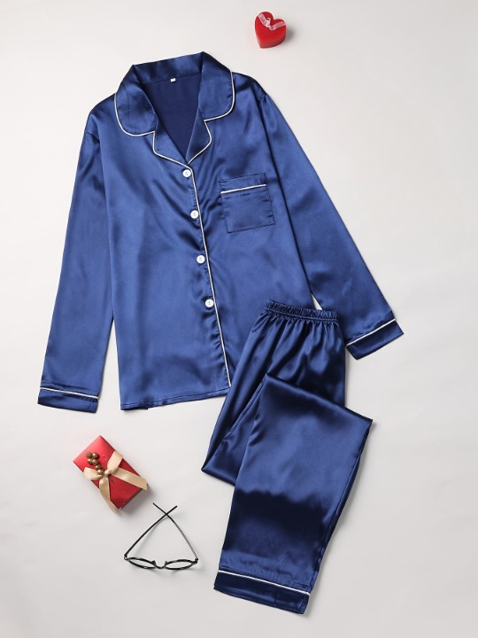 Ladies' satin pajama set with soft shine fabric. Luxurious two-piece nightwear for comfortable sleep.