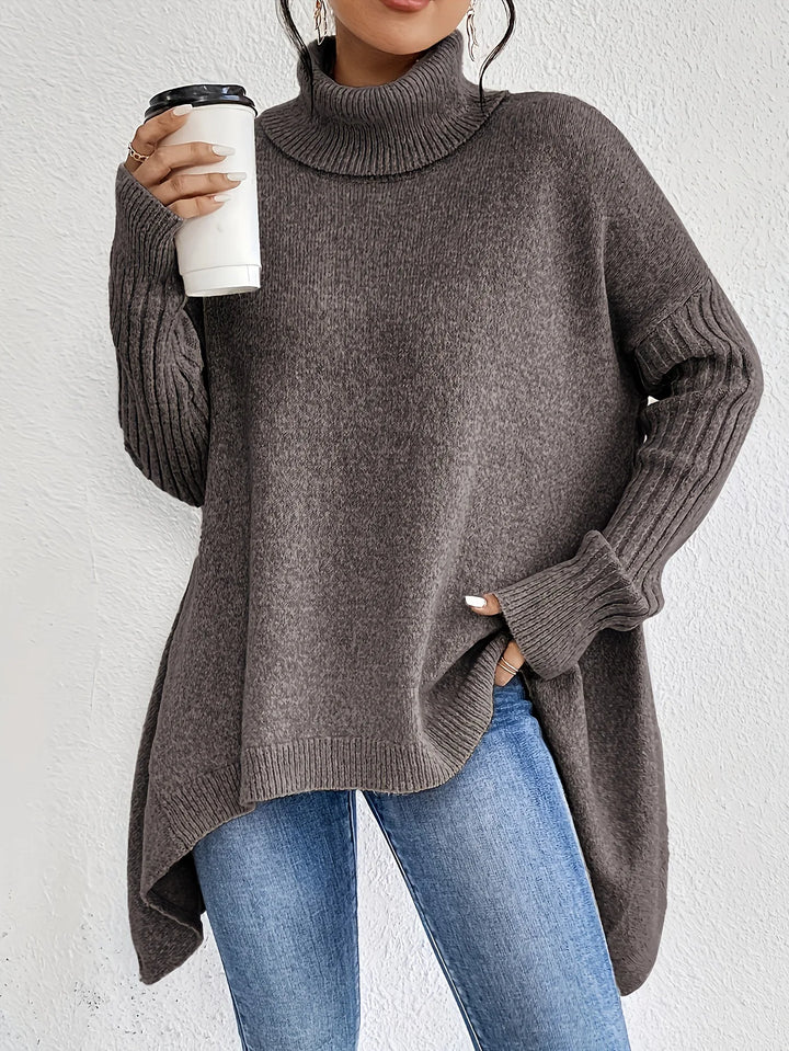 Close-up of a women's cashmere blend turtleneck sweater, highlighting its soft knit and quality.