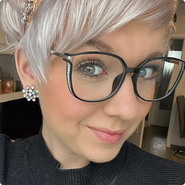 Close-up of luxurious women's reading glasses, showcasing elegant details & comfortable eyewear design.