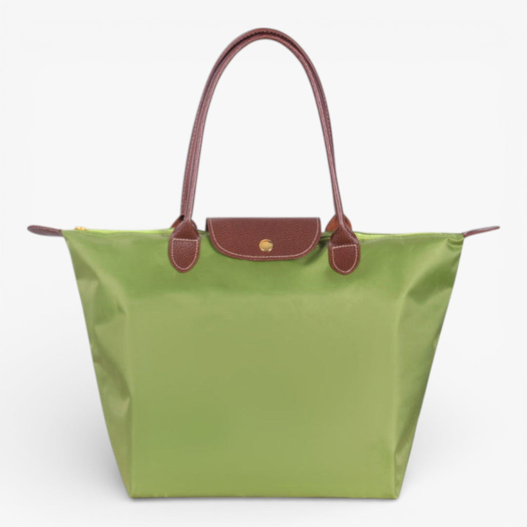 Front view of women's luxury shoulder handbag. Spacious, stylish, and secure with zip closure.