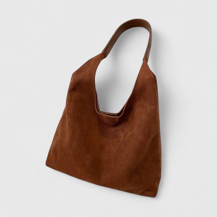 Chic women's minimalist shoulder bag, ideal for daily essentials and outfits.