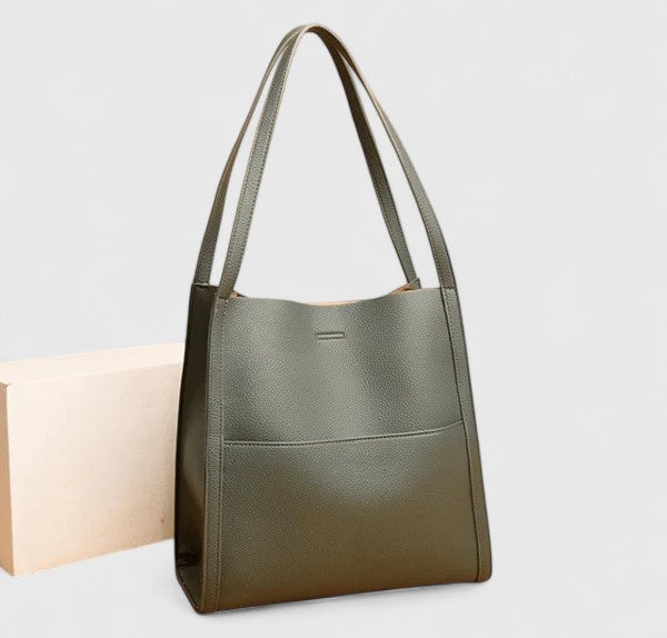 Women's minimalist vegan leather shoulder bag in a chic black finish, perfect for everyday use.