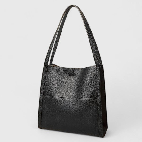 Refined summer shoulder bag for women, made from vegan leather, embodying simple and chic style.