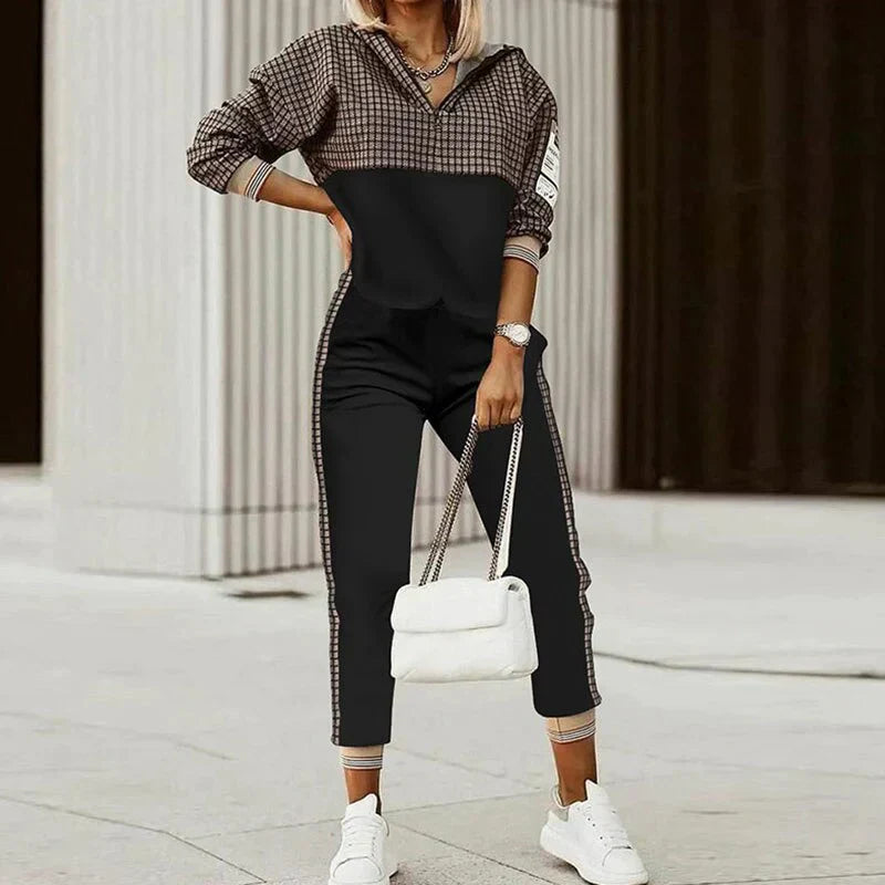 Stylish women's two-piece tracksuit featuring a comfortable zipper top, perfect for casual wear.