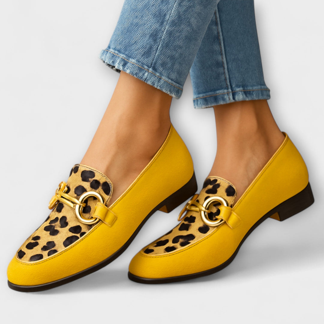 Women's modern comfort loafers with black and white animal print, designed for stylish casual wear