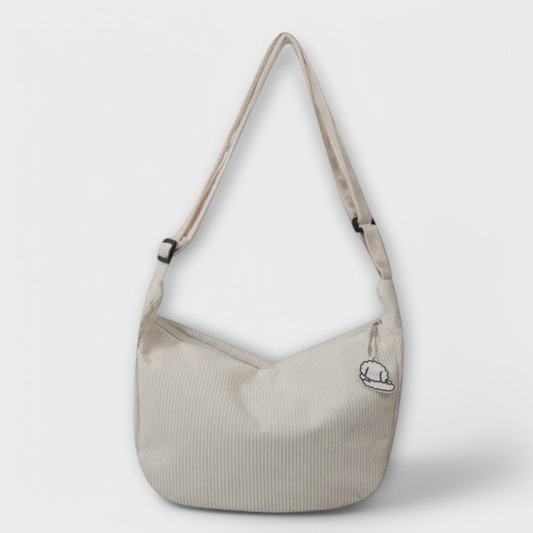 Black elegant curved shoulder bag for women, a timeless modern handbag design
