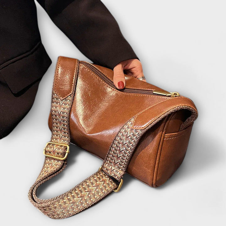 Women's modern everyday shoulder bag with a stylish patterned strap, front view.