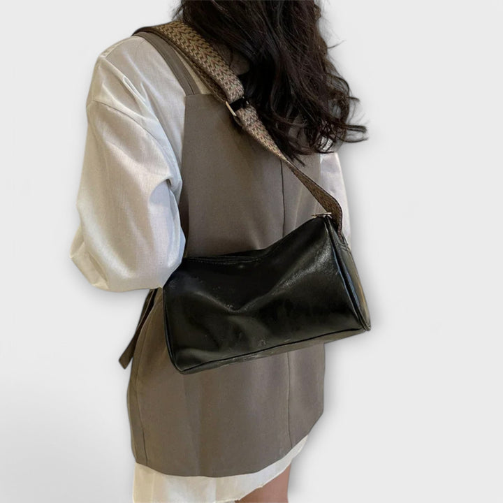 Casual women's shoulder bag with a unique patterned strap, perfect for daily use.