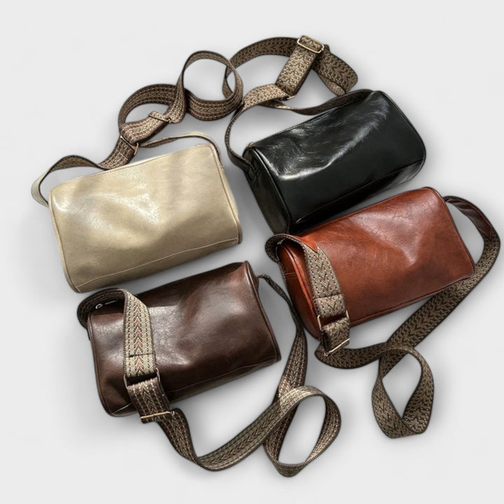 Everyday fashion bag for women featuring a trendy patterned strap and gold hardware.