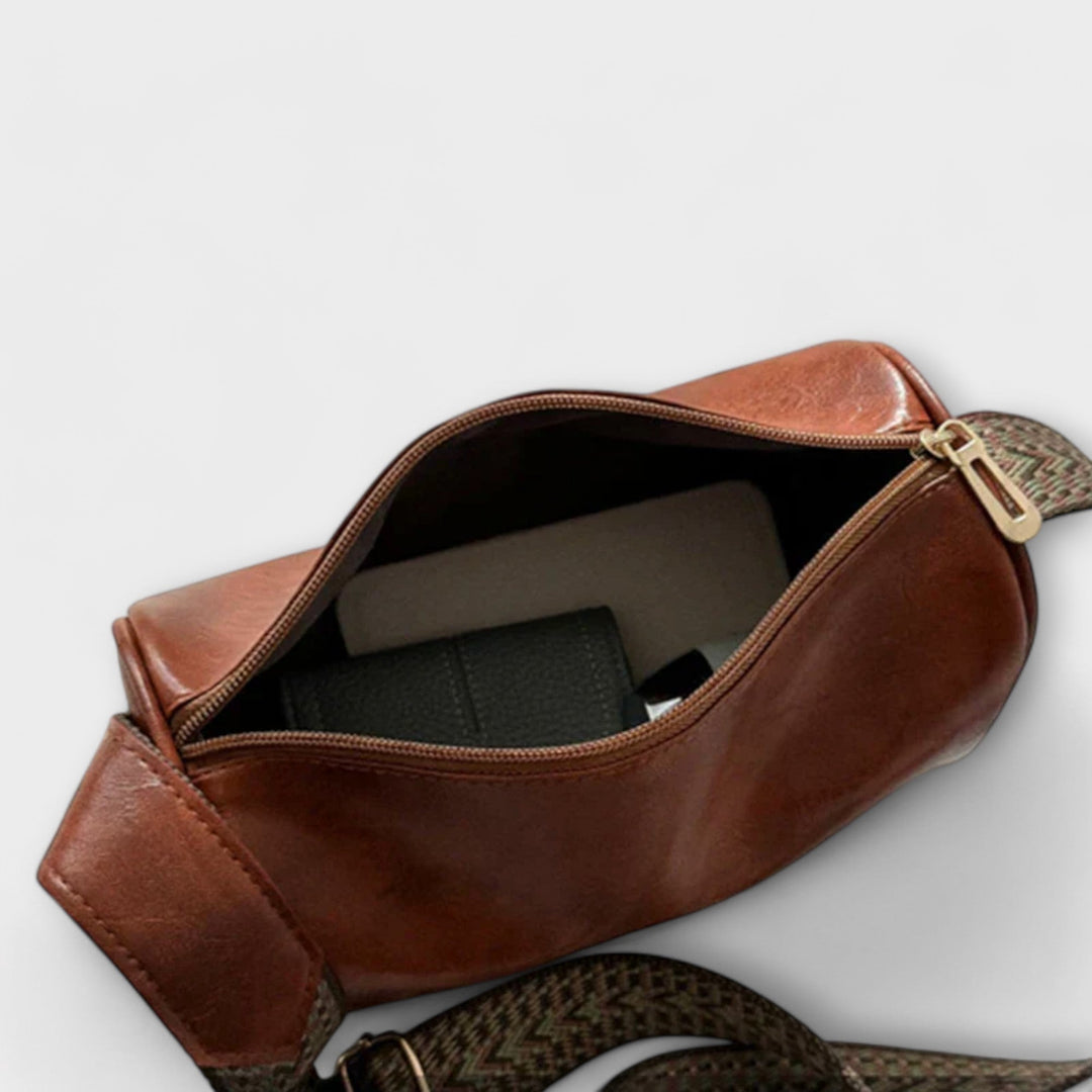 Women's versatile shoulder bag with a playful patterned strap, ideal for summer outfits.