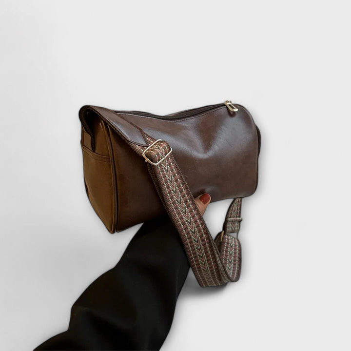 Stylish women's everyday bag showcasing its patterned strap and spacious design.