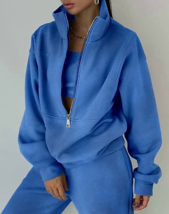 Stylish women's athleisure twopiece set featuring a half-zip sweatshirt and matching joggers.