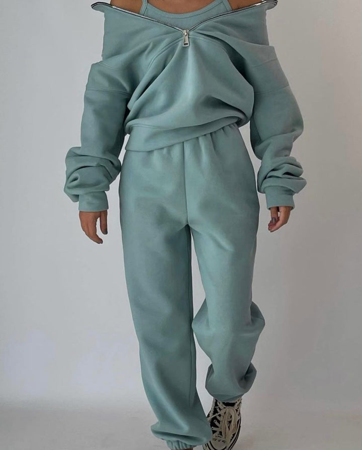 Front view of a women's half-zip sweatshirt and jogger set, emphasizing its modern loungewear style.