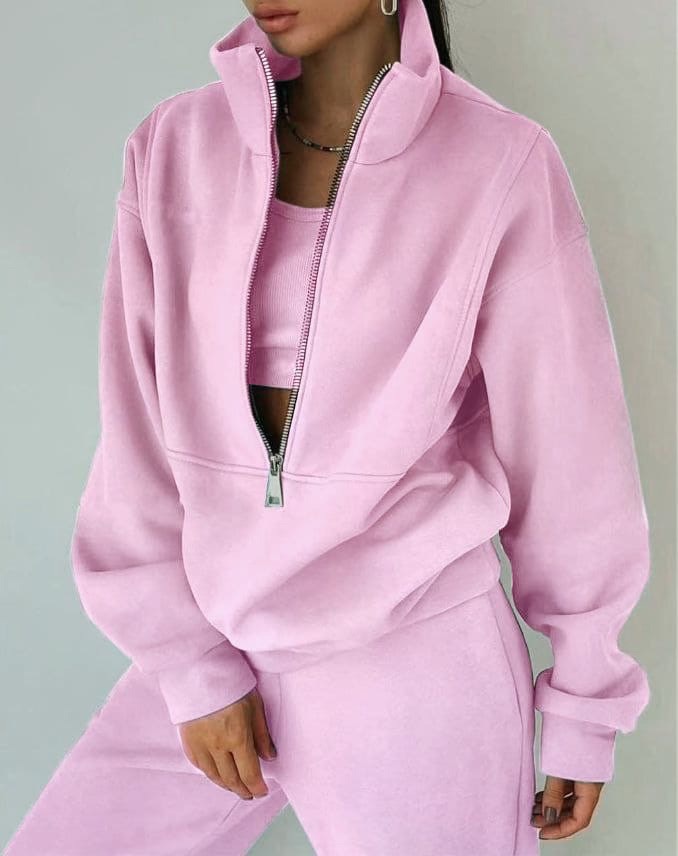 Comfortable women's twopiece set: a trendy half-zip sweatshirt paired with matching joggers for athleisure.