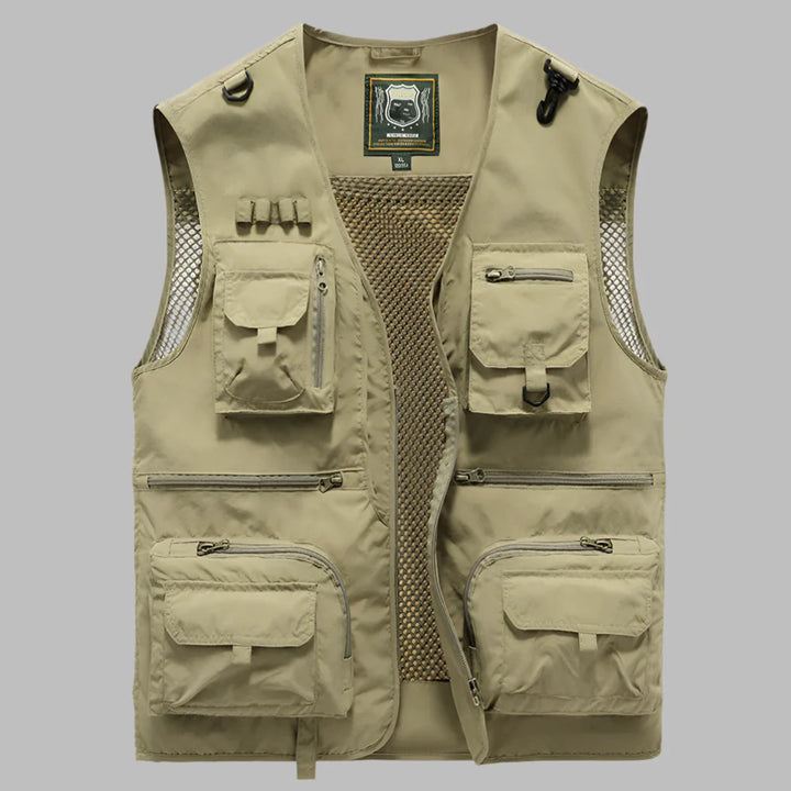 Water-resistant women's utility vest with many pockets, suitable for outdoor activities.