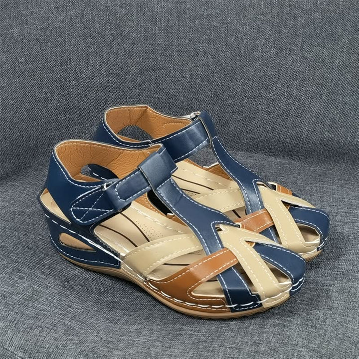 Supportive women's walking sandals with multiple straps, ideal for all-day comfort & secure fit on casual outings.