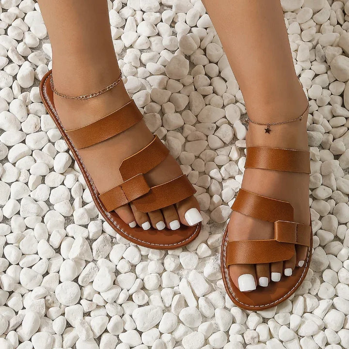 Women's multi-strap flat slide sandals, perfect for summer comfort & everyday minimalist style.