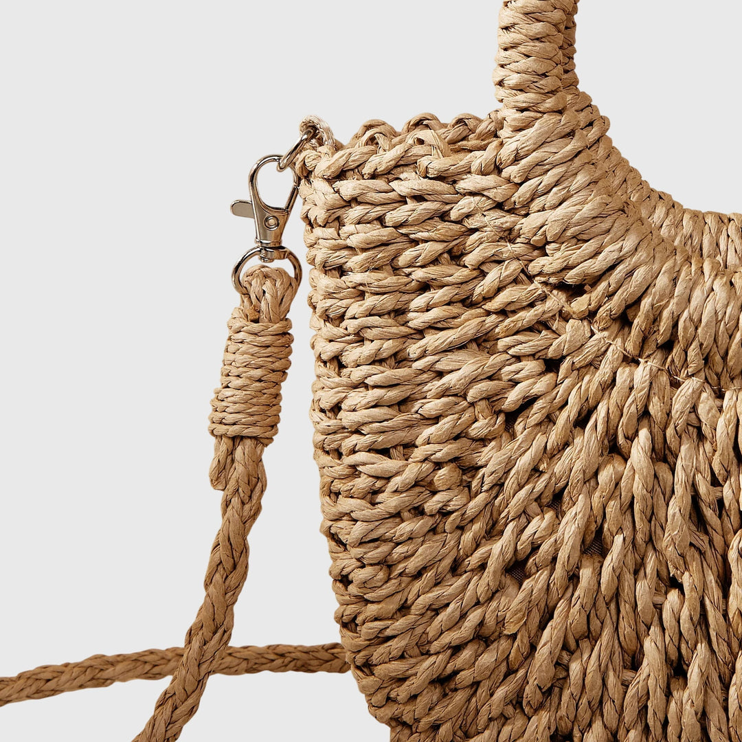 Close-up of a women's natural style handbag showcasing its unique woven design and colors
