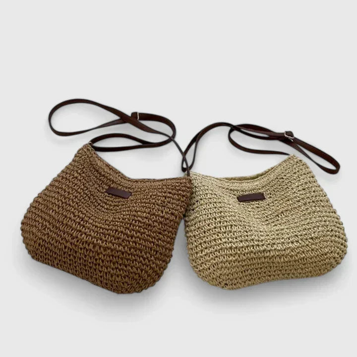Women's natural woven summer shoulder bag with leather strap, perfect for beach or casual outings.