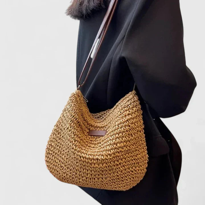 Handcrafted natural woven shoulder bag for women, a stylish and practical summer essential.