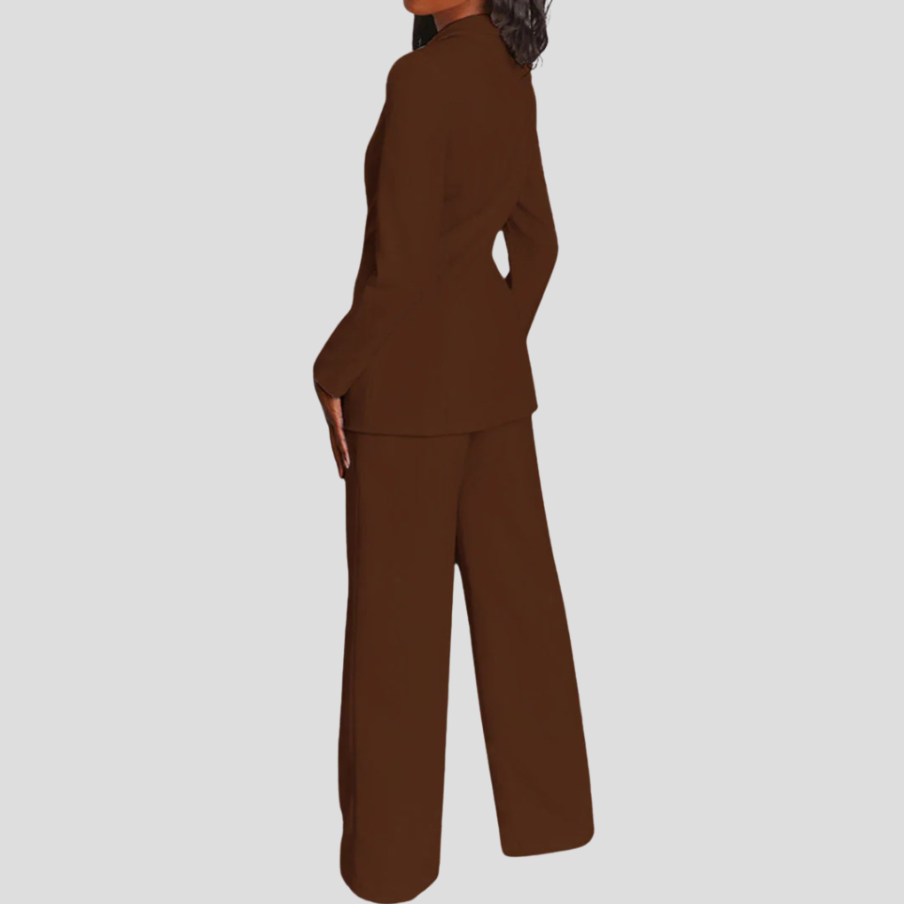 Full-body shot of a woman wearing a blue blazer and straight-leg trouser co-ord set, business casual.
