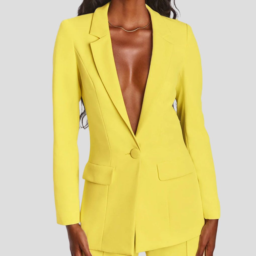 Modern women's coordinated grey blazer and straight-leg trousers, focus on tailored fit & fabric.