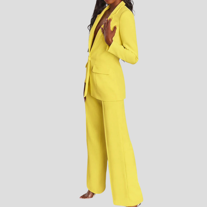 Elegant women's beige trouser suit with single-button blazer, ideal for business attire, full length.