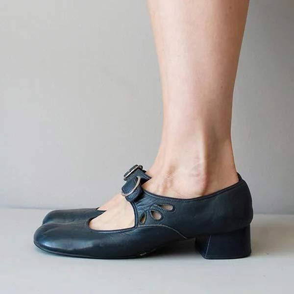 Comfortable women's classic style leather slip-on shoes with a low heel, in a neutral tone for daily wear.
