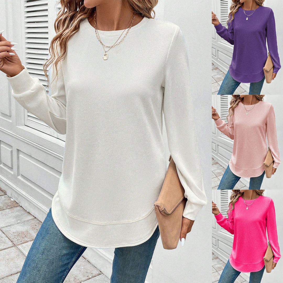 Women's O-neck long sleeve cotton blend top styled with jeans for a comfortable spring casual look.