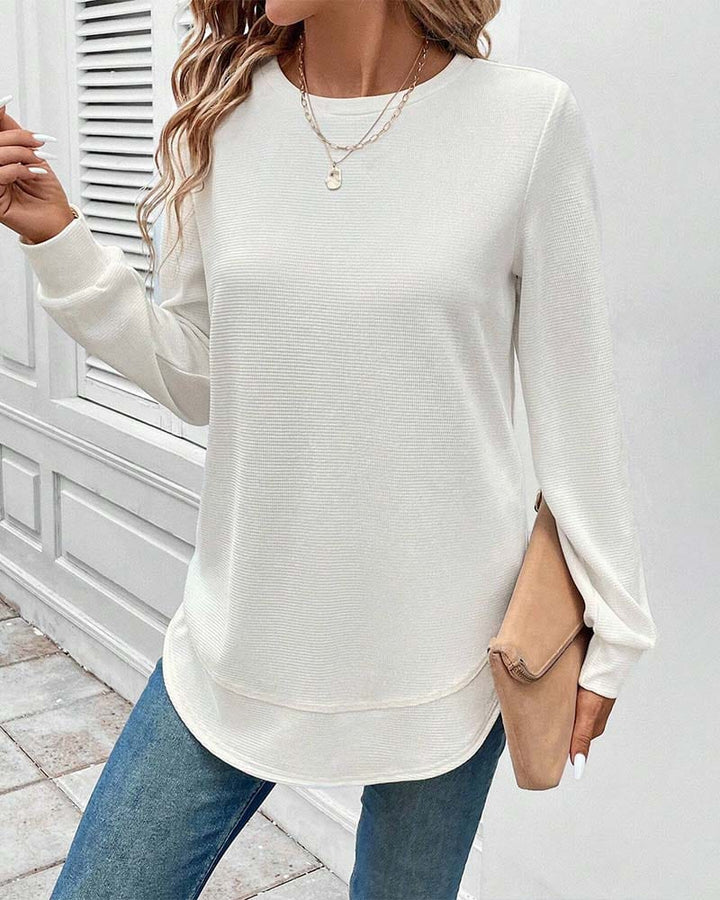 Model wearing an O-neck cotton blend long sleeve top, showcasing its comfortable and versatile fit.