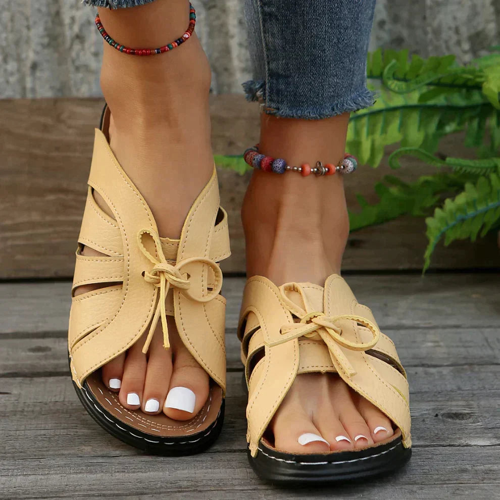 Women's stylish wedge sandals, open toe, featuring a beautiful knot detail. Comfort fit summer shoes.